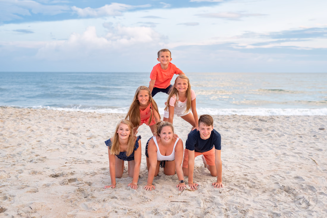 Kids making a pyramid - Huntington Beach State Park
