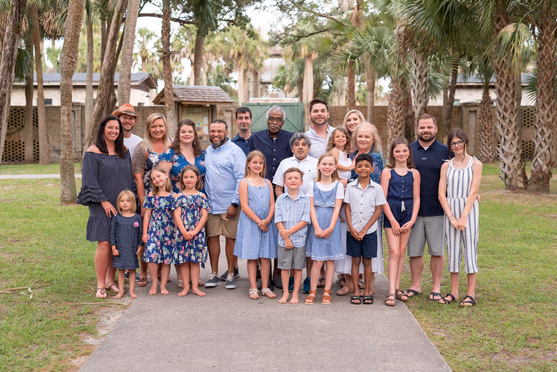 Large family group in front of the Atalaya Castle at Huntington Beach State Park
