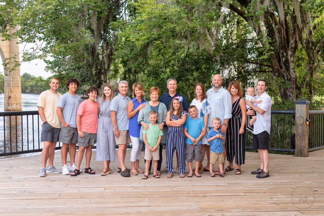 Extended family gathered on the dock by the Waccamaw River at the Conway Riverwalk