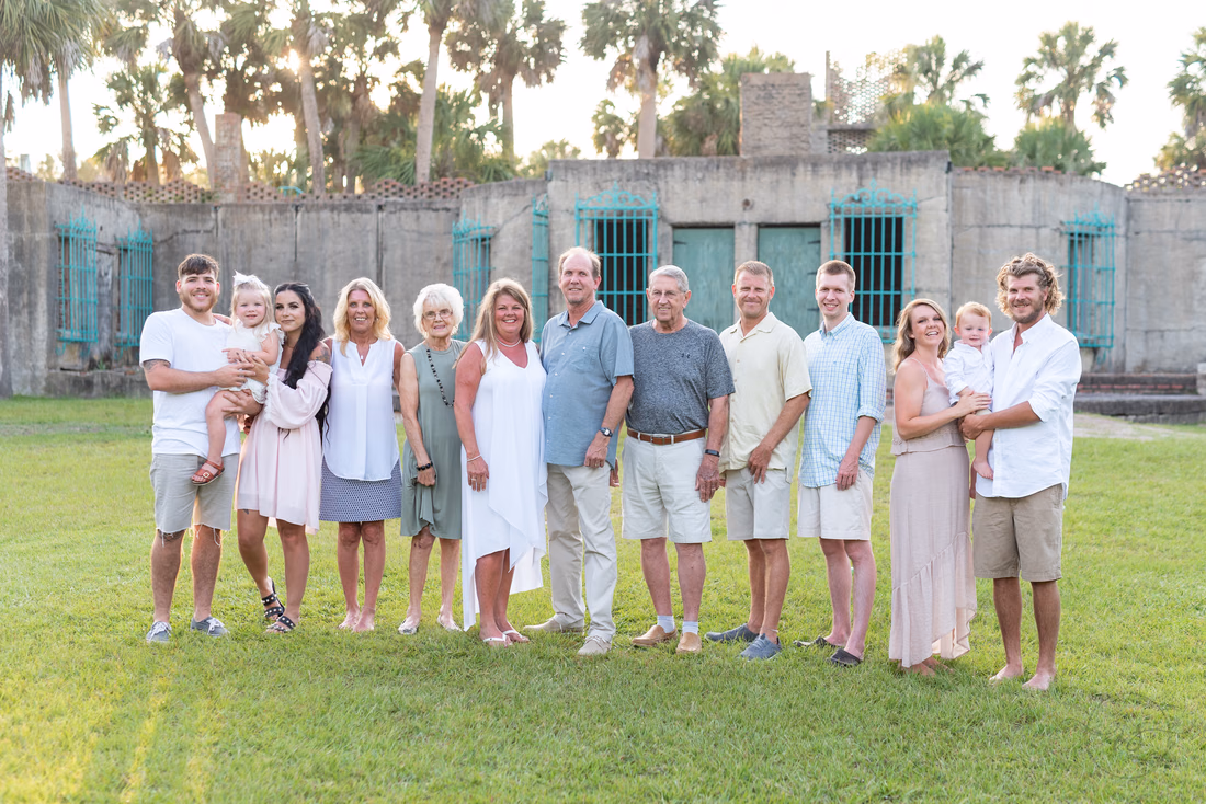 Large family standing behind the Atalaya Castle - Huntington Beach State Park