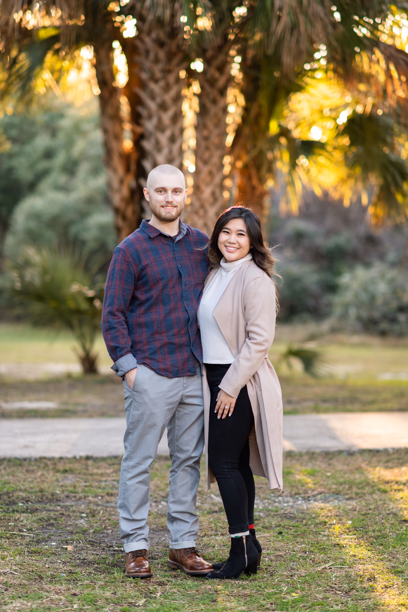 Couple posing in front of the palms - Huntington Beach State Park