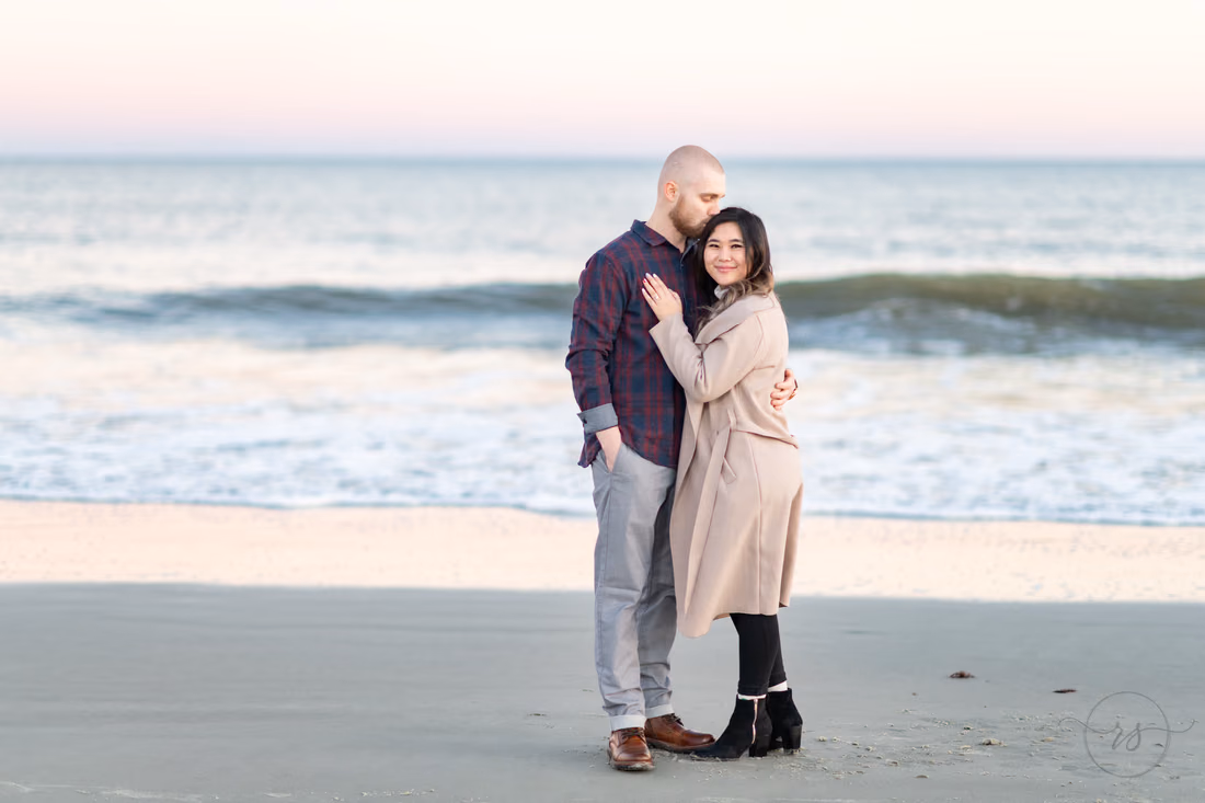 Kiss on the head in front of the ocean - Huntington Beach State Park