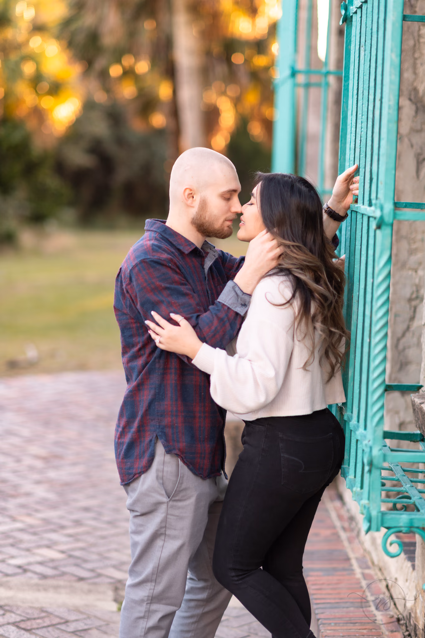 Kissing by the wrought iron windows - Huntington Beach State Park