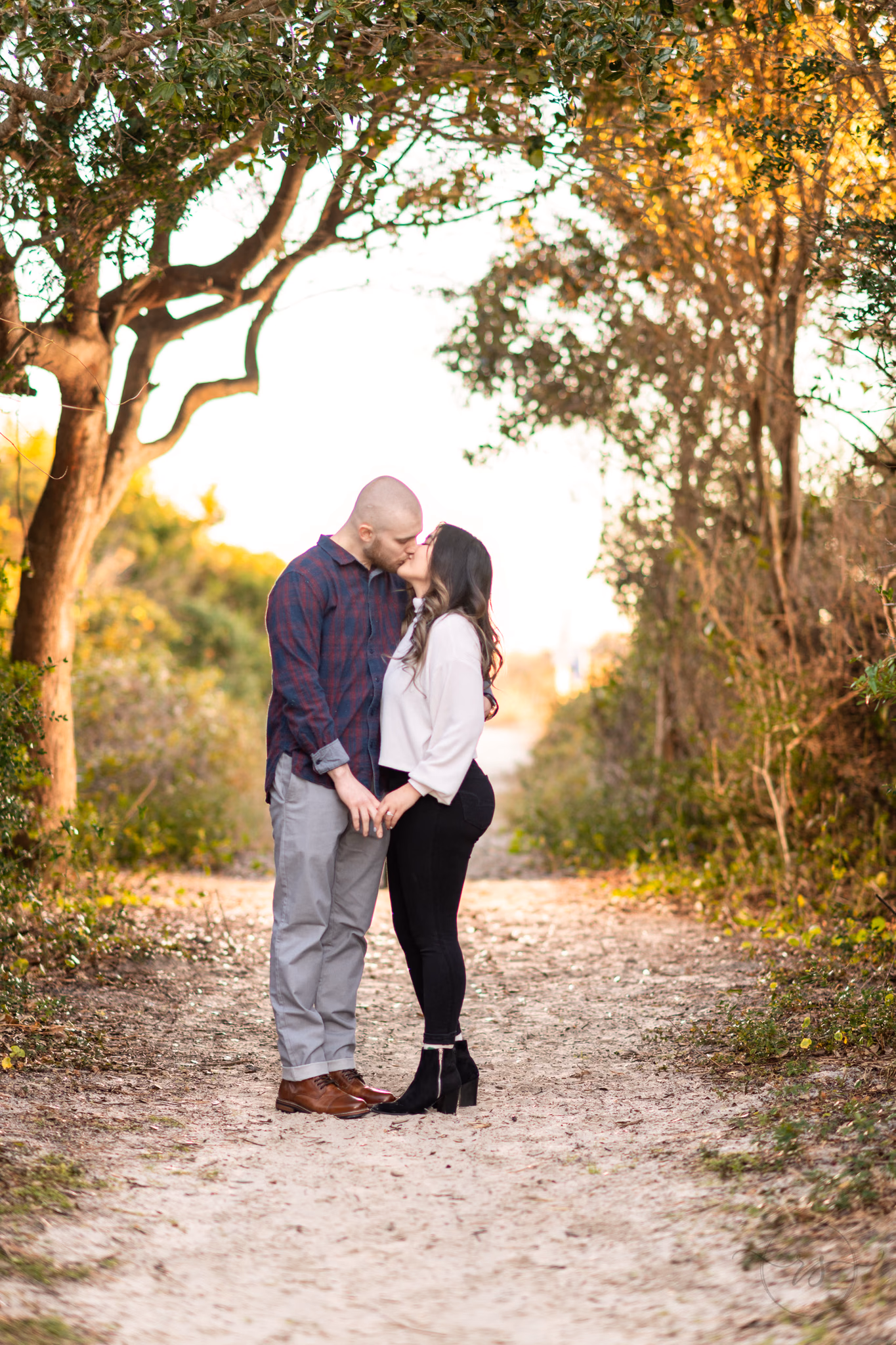 Kissing on the path to the beach - Huntington Beach State Park