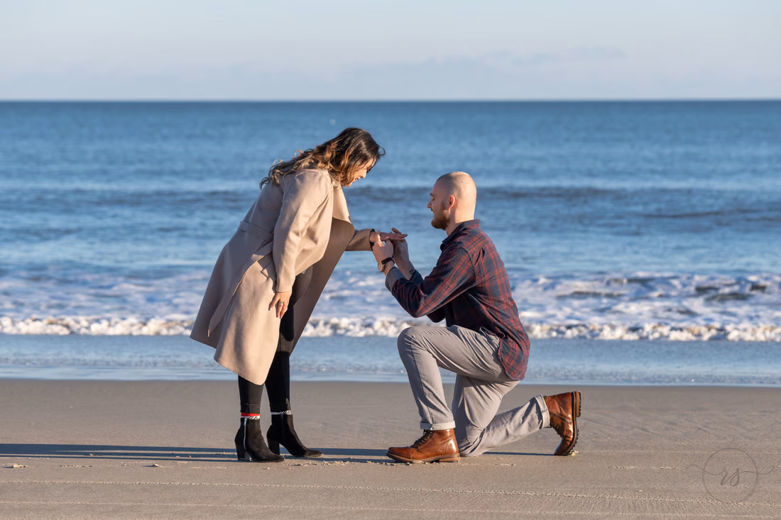 Putting on the engagement ring - Huntington Beach State Park