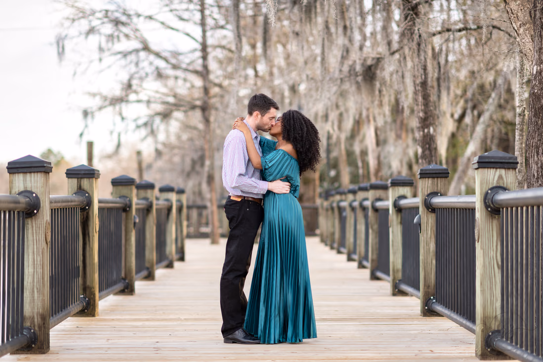 Anniversary kiss from a low angle for a great view of the moss - Conway Riverwalk