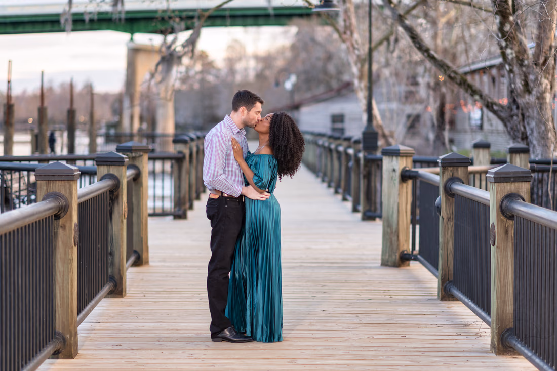 Kiss with the boardwalk going out of focus in the background - Conway Riverwalk