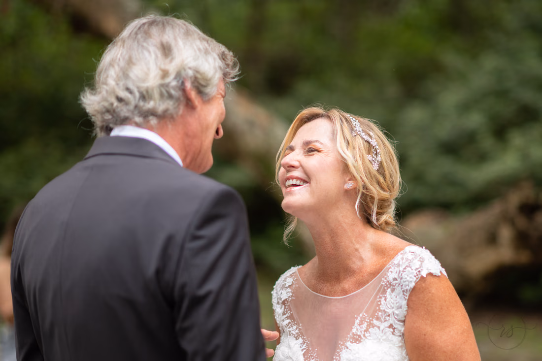 Bride laughing during the vows - Holiday Cottage - Brookgreen Gardens