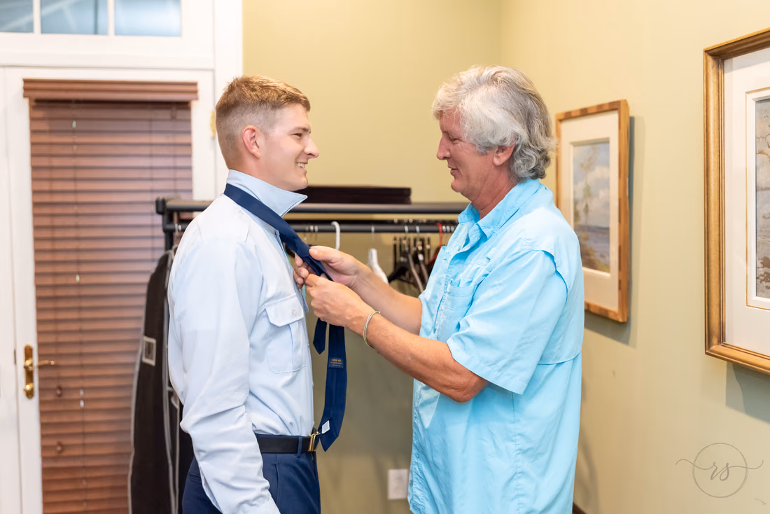 Groom putting on his son's tie - Holiday Cottage - Brookgreen Gardens