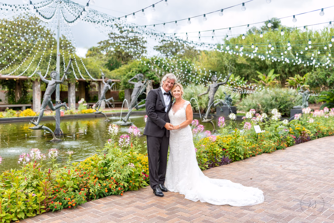 Holding hands in front of the statues - Fountain of the Muses - Brookgreen Gardens