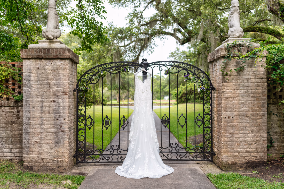 Wedding dress hanging on the holiday cottage gates - Holiday Cottage - Brookgreen Gardens