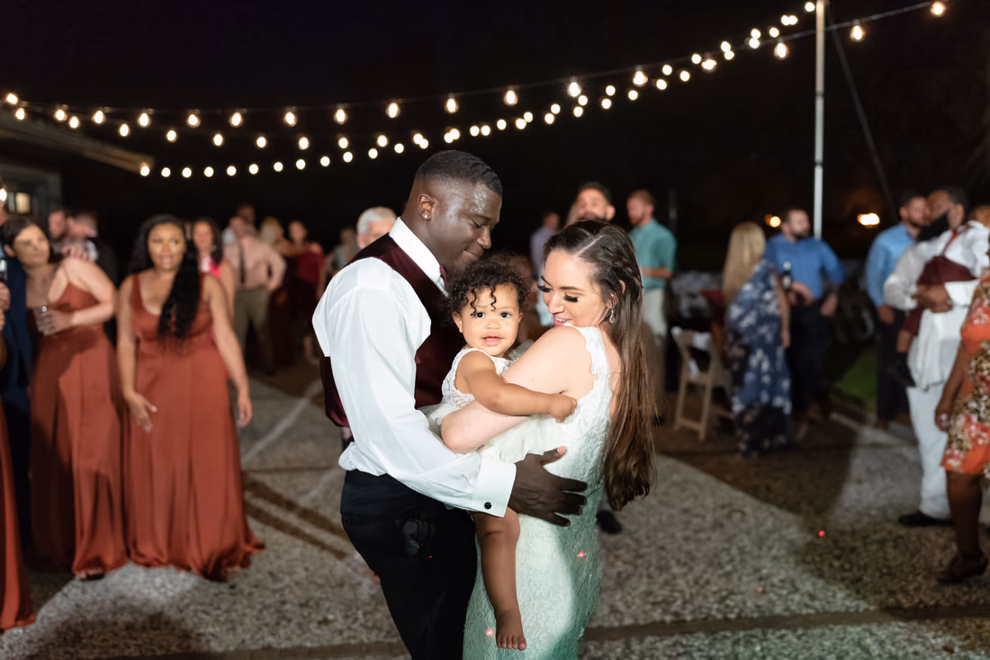 Bride and groom dancing with baby girl - Magnolia Plantation - Charleston, SC