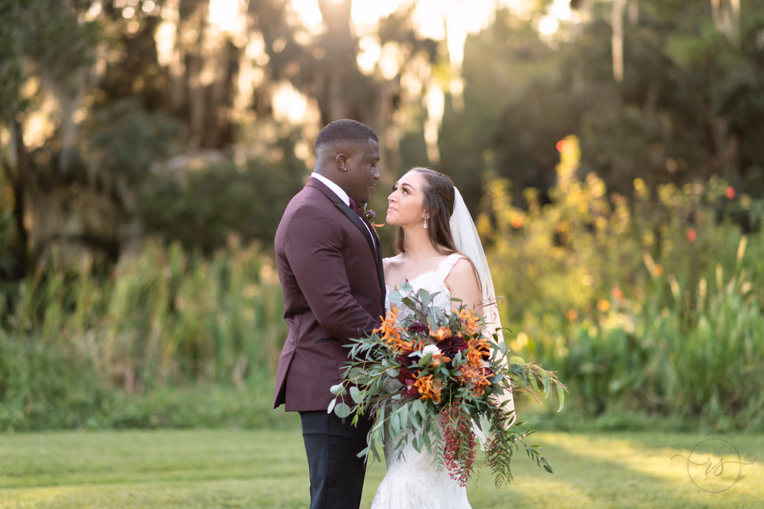 Close portrait of the couple in the warm sunset light at Magnolia Plantation