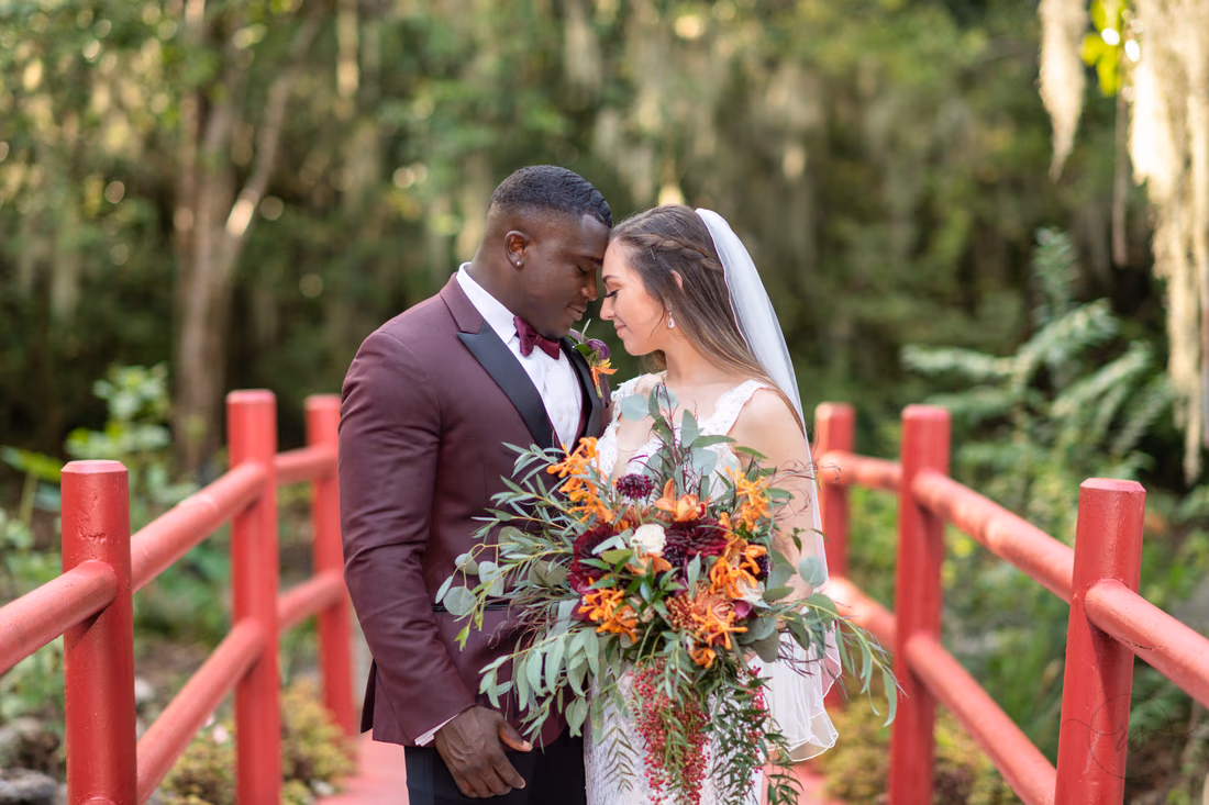 Bride and groom touching foreheads - Magnolia Plantation - Charleston, SC