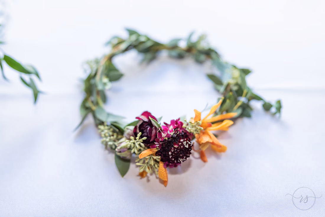 Flower crown of burgundy and orange blooms at Magnolia Plantation