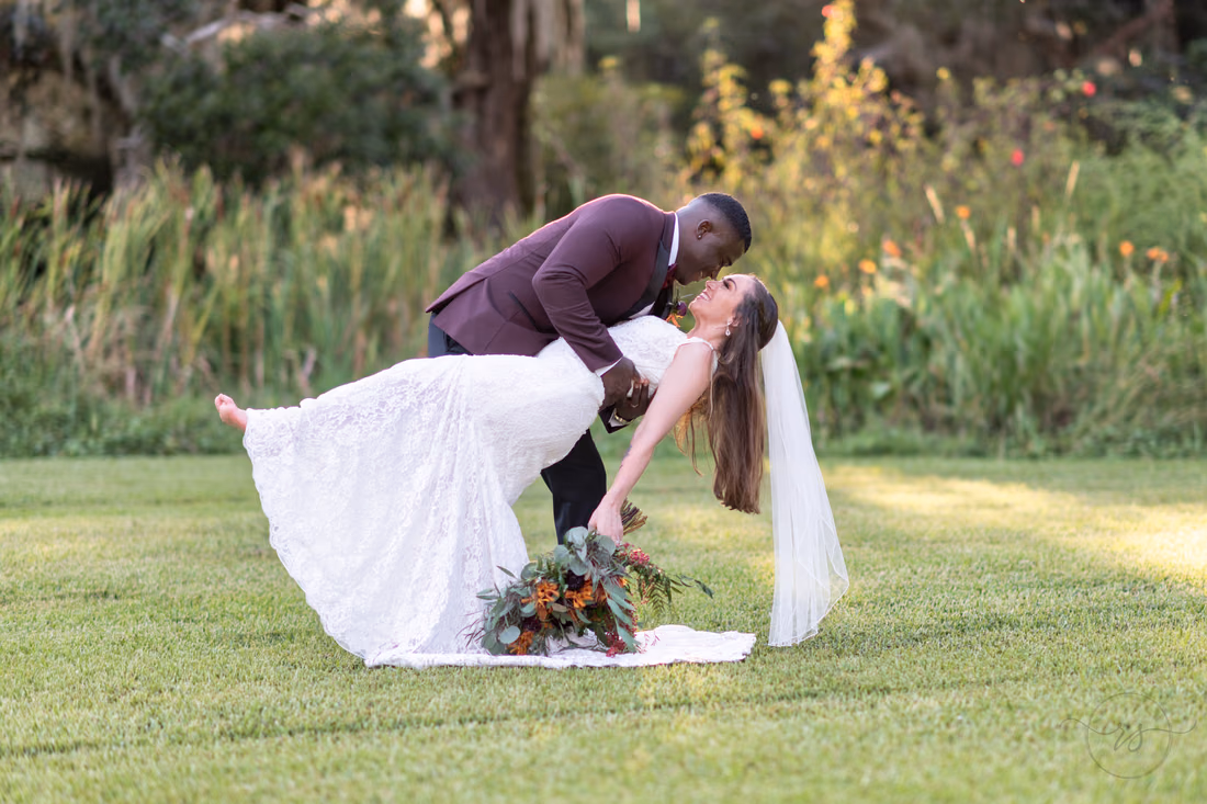 Groom dipping back the bride - Magnolia Plantation - Charleston, SC