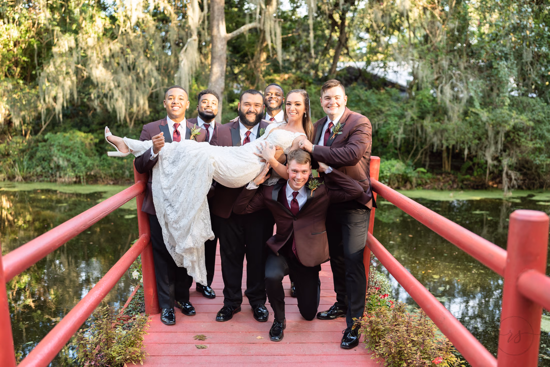 Groomsmen lifting up the bride - Magnolia Plantation - Charleston, SC