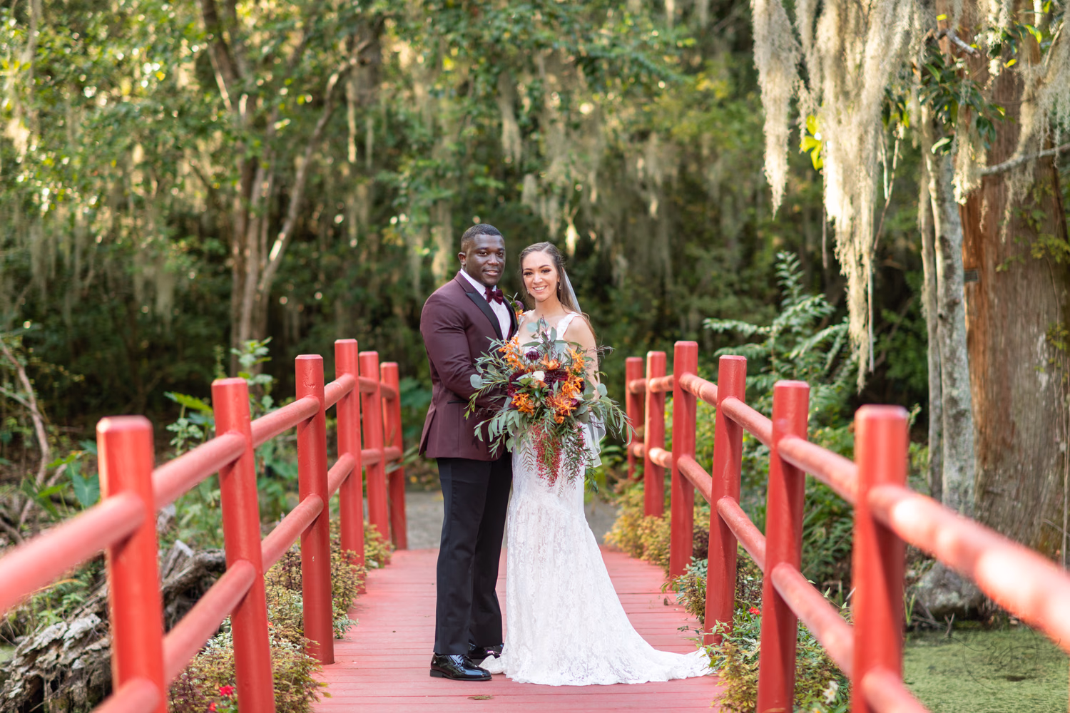 Portraits of bride and groom on the red bridge - Magnolia Plantation - Charleston, SC
