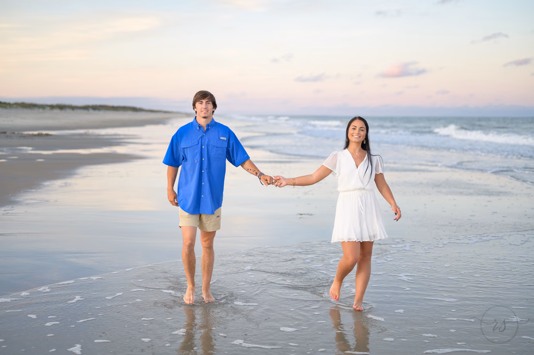 Boyfriend and girlfriend walking down the beach - Huntington Beach State Park