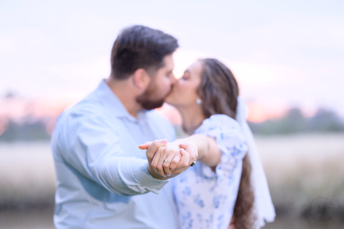 Closeup of the ring kissing in the background - Caledonia Golf and Fish Club