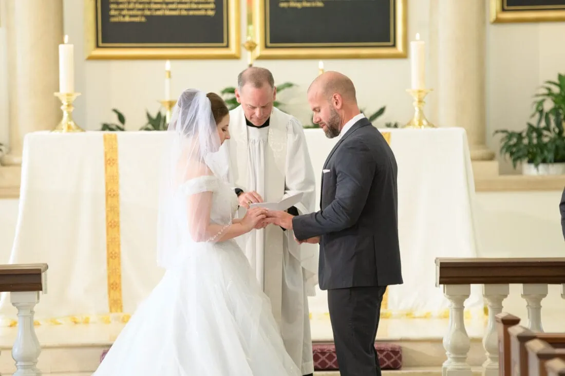 Bride putting ring on the groom - Christ Episcopal Church