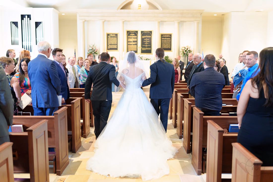 Bride walking toward the altar, seen from behind - Christ Episcopal Church