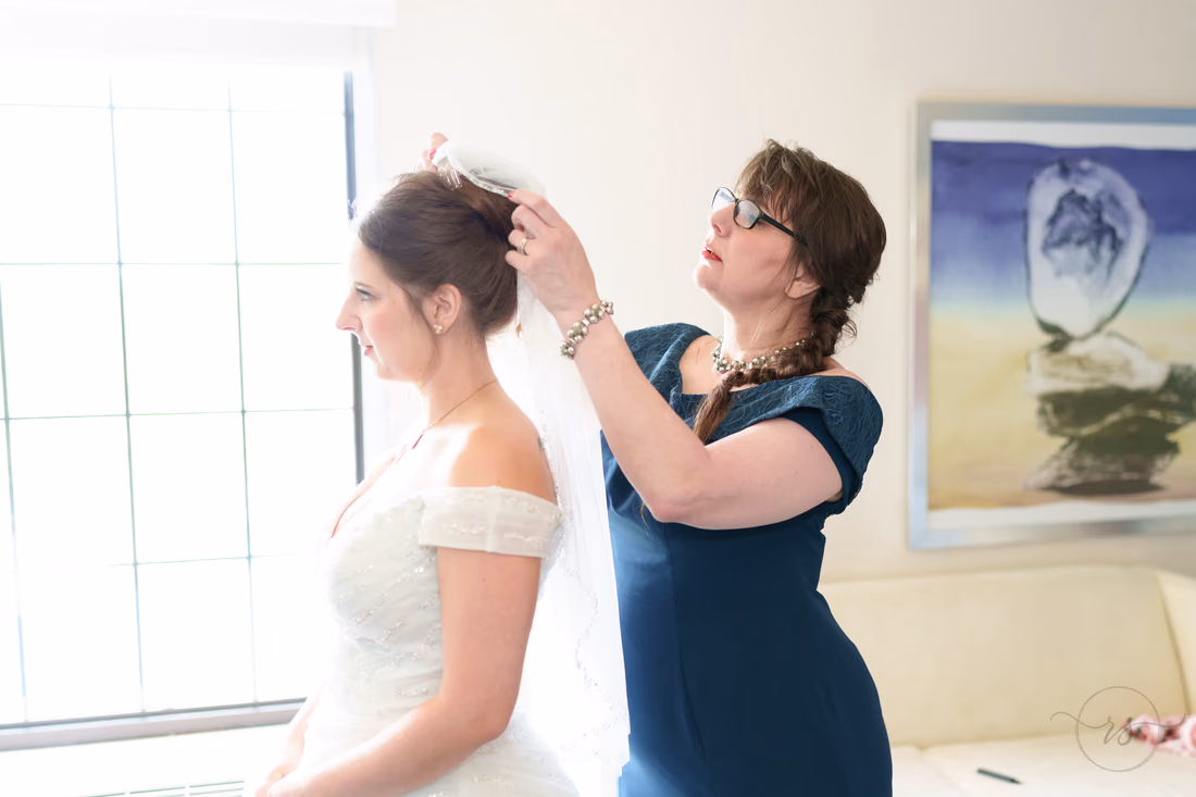 Bride's mother putting on the veil - Hotel Indigo
