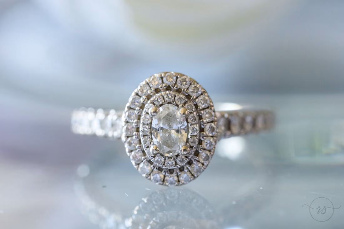Close-up of the oval halo engagement ring - Hotel Indigo
