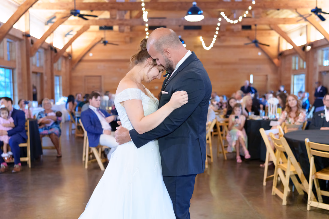Bride and groom forehead to forehead at the end of their first dance - The Pavilion at Pepper Plantation