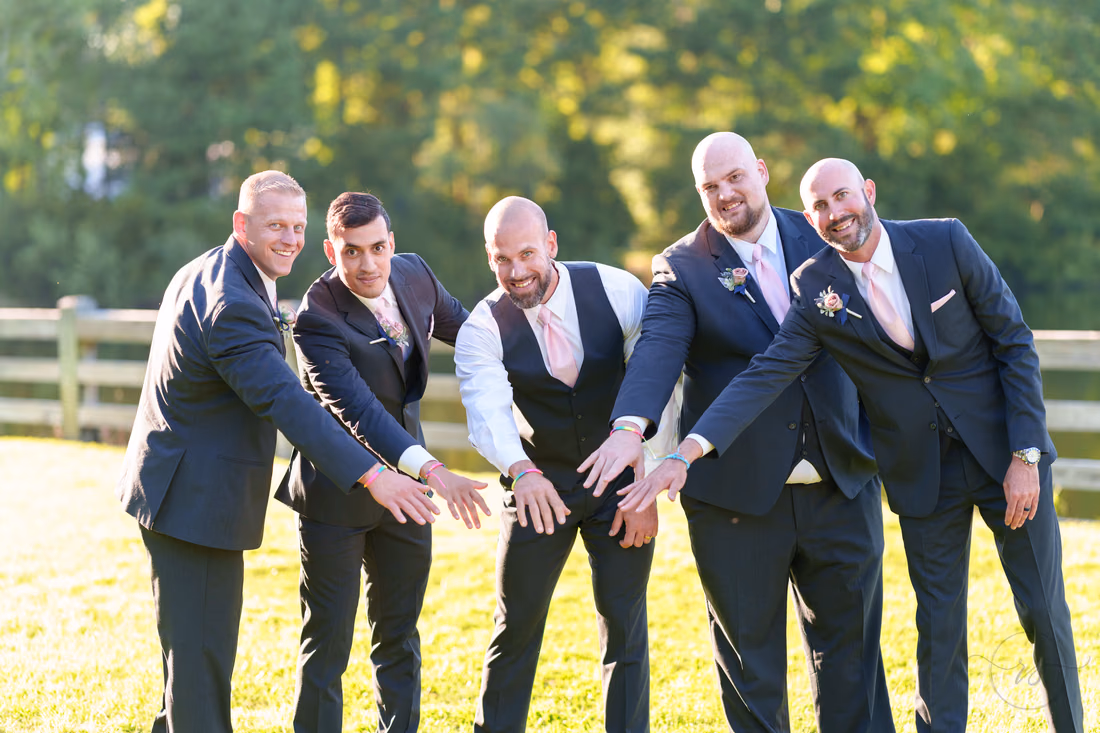Groomsmen showing off their friendship bracelets - The Pavilion at Pepper Plantation