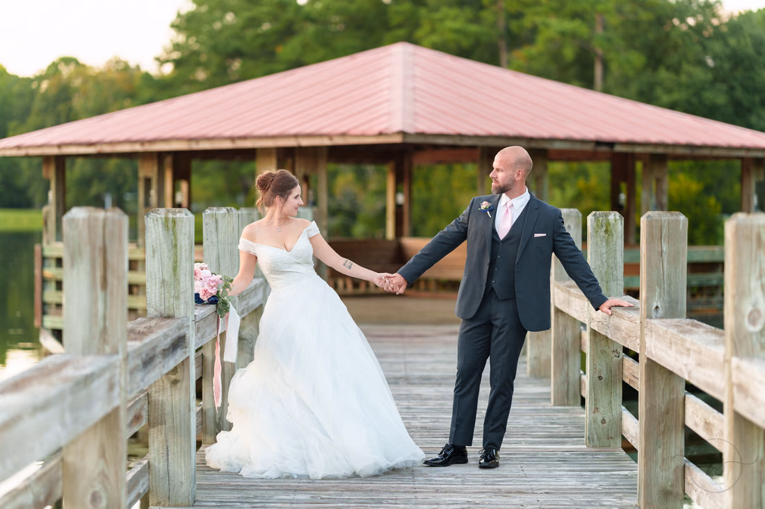 Holding hands looking at each other - The Pavilion at Pepper Plantation