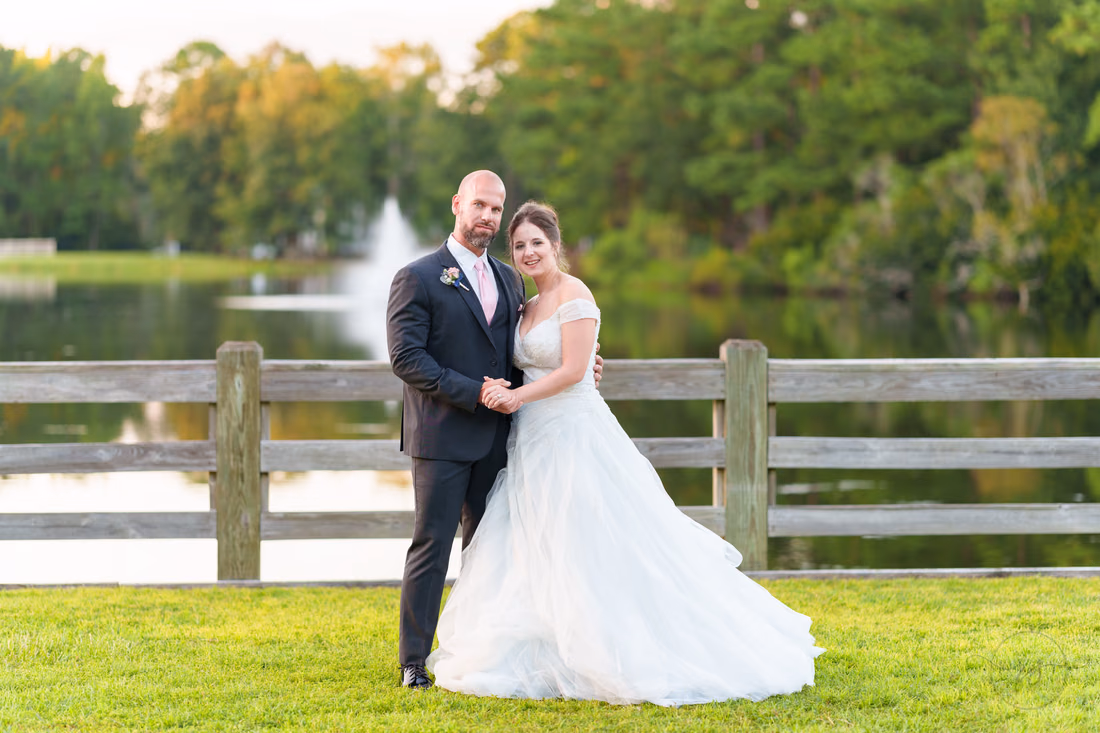 Sunset portraits with bride and groom in front of the lake and fountain - The Pavilion at Pepper Plantation