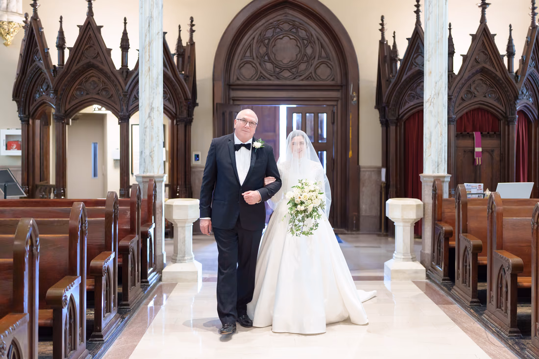Bride and father starting down the aisle - Cathedral of Saint John Charleston