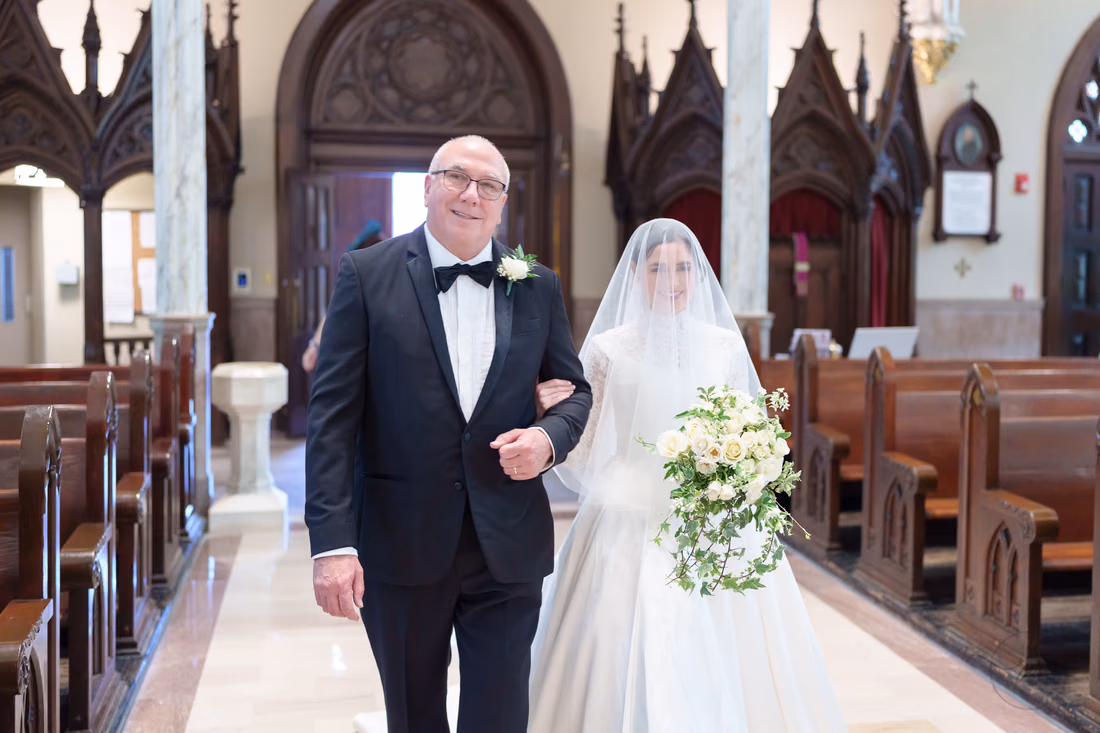 Father smiling as he walks the veiled bride down the aisle - Cathedral of Saint John Charleston