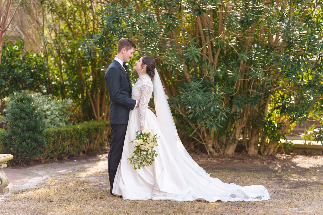 Bride and groom in the courtyard of the cathedral - Cathedral of Saint John Charleston