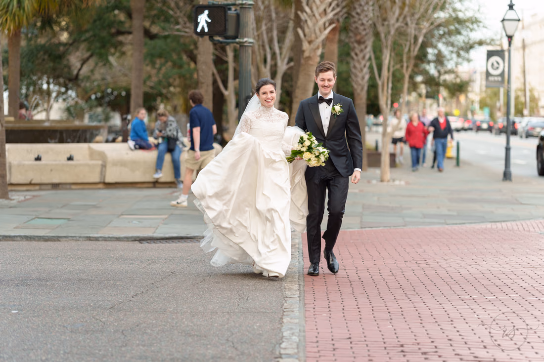 Bride and groom crossing the street back to the hotel - Marion Square Charleston
