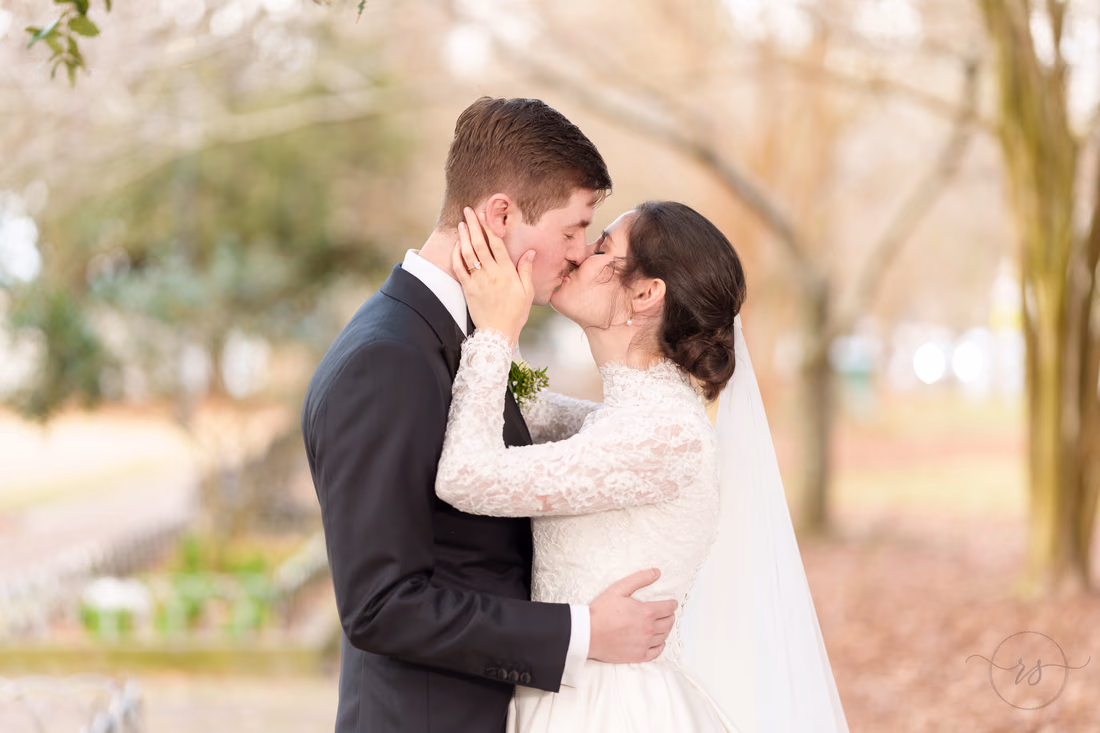 Bride pulling the groom in for a kiss - Marion Square Charleston