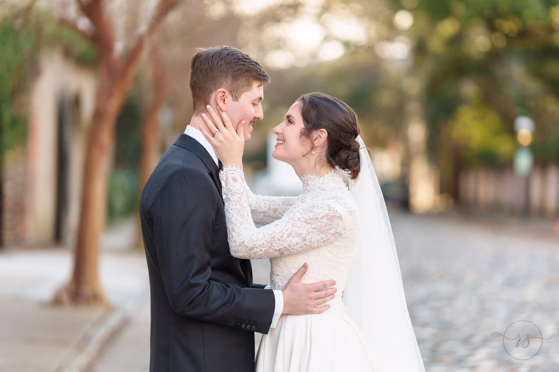 Closeup of bride pulling in groom for a kiss - Chalmers Street