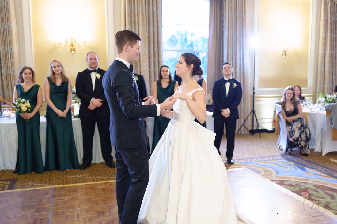 Bride and groom starting their first dance as the wedding party watches - Francis Marion Charleston