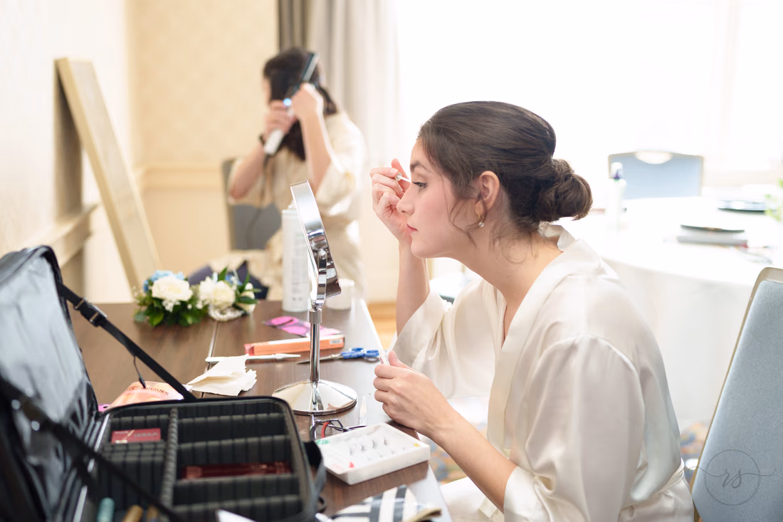 Bride doing her makeup in the getting-ready room - Francis Marion Charleston