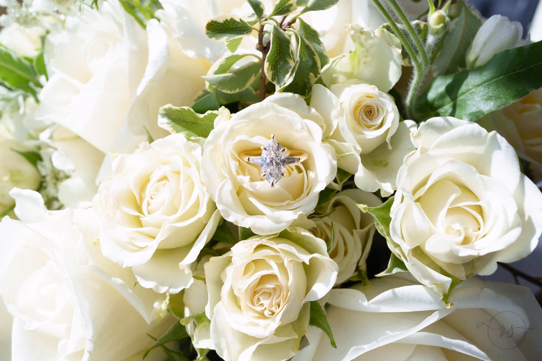 Engagement ring tucked into the white rose bouquet - Francis Marion Charleston