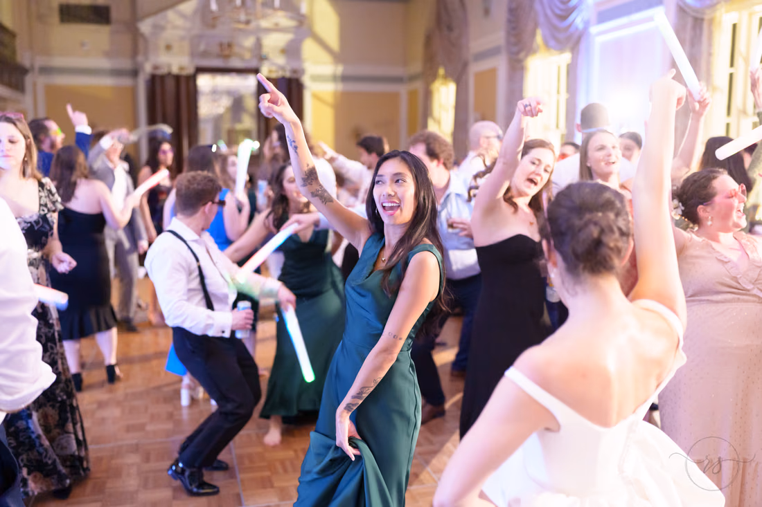 Bride and guests dancing with light sticks in the air - Francis Marion Charleston