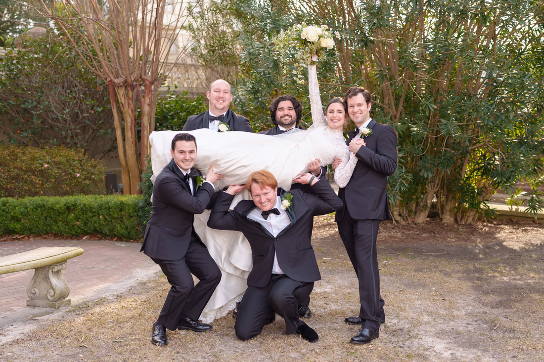 Groomsmen picking up the bride - Cathedral of Saint John Charleston