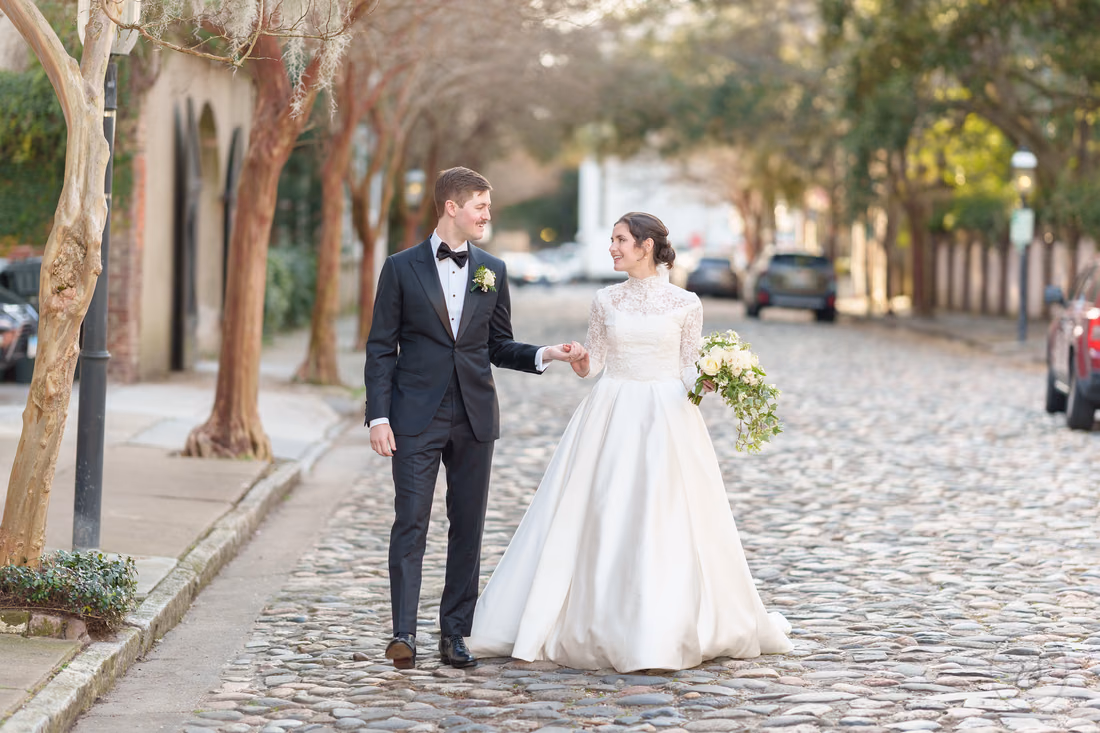Holding hands on the cobblestone street, facing the camera - Chalmers Street