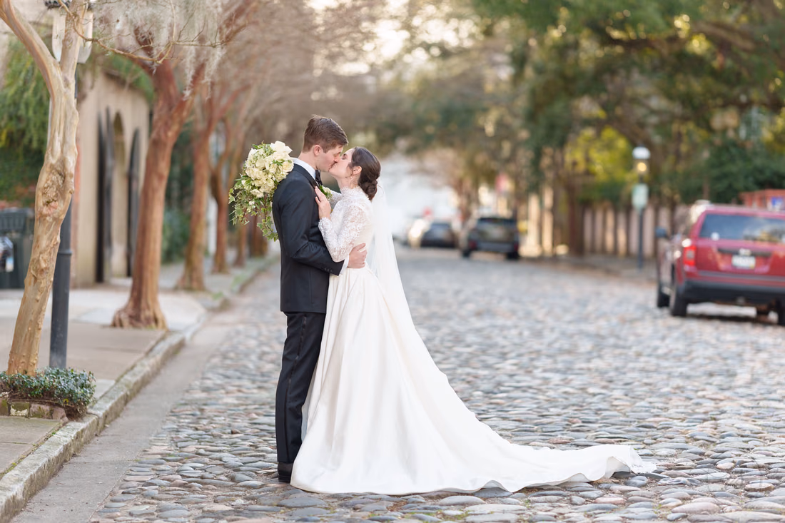 Kiss with flowers behind the groom - Chalmers Street