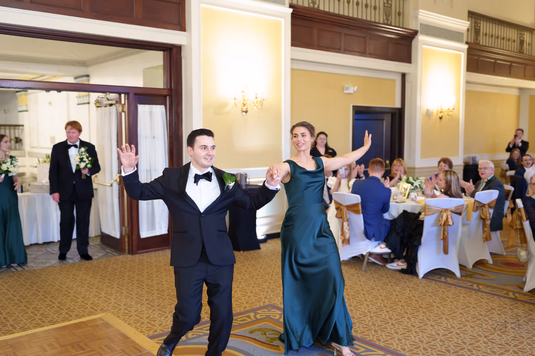 Groomsman and bridesmaid making a fun entrance - Francis Marion Charleston
