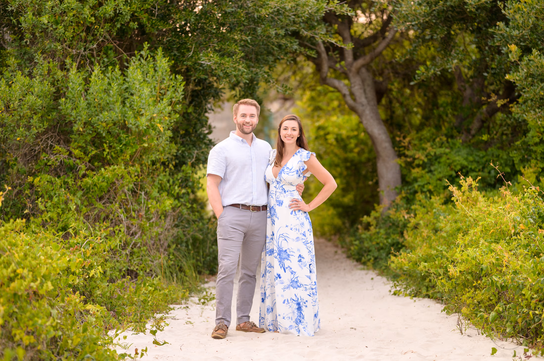 Couple standing together on the sandy path to the beach - Huntington Beach State Park