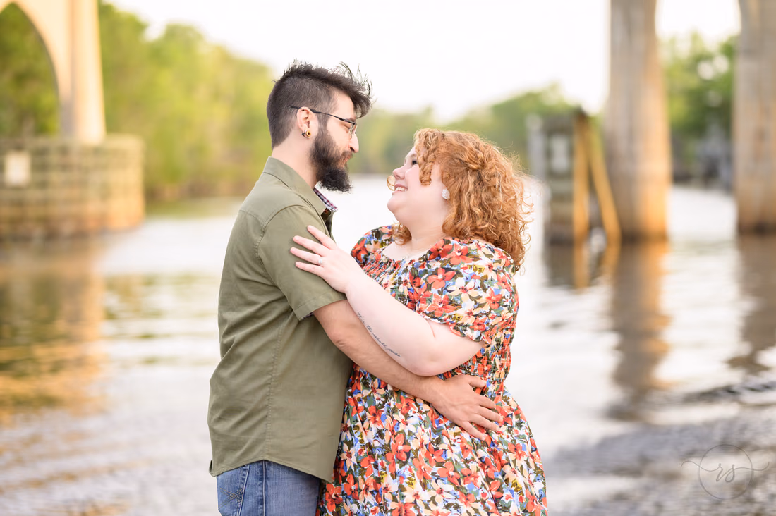 Couple looking into each other's eyes by the Waccamaw River - Conway Riverwalk