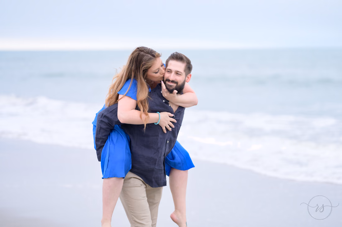Piggyback ride and a kiss on the cheek by the ocean - Huntington Beach State Park