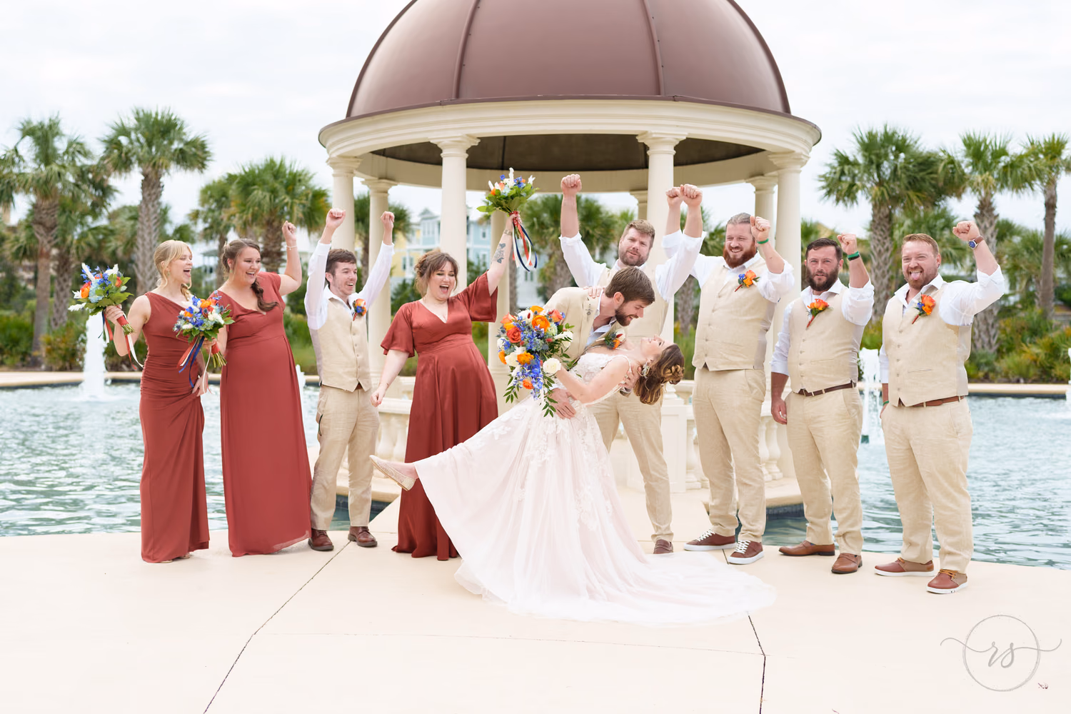 Dip back for a kiss with cheers from the wedding party - 21 Main Events - North Myrtle Beach
